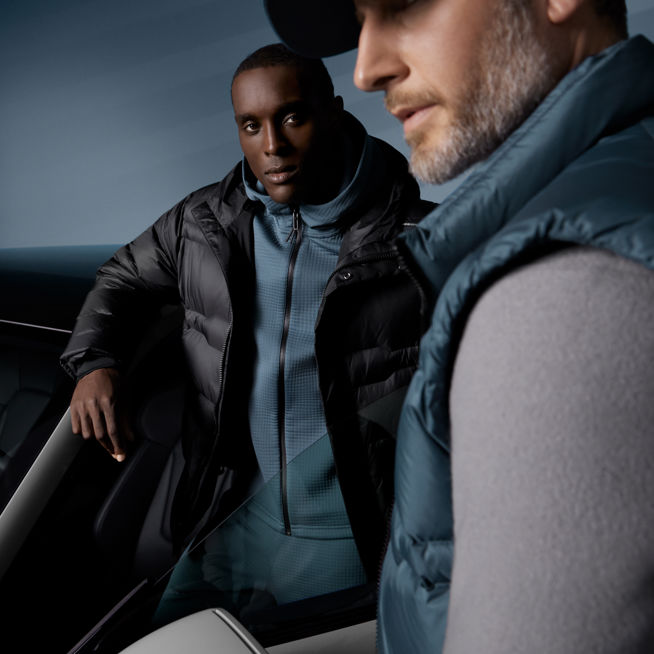 Shows Picture of two-men-wearing-porsche-design-fashion-next-to-white-porsche.jpg